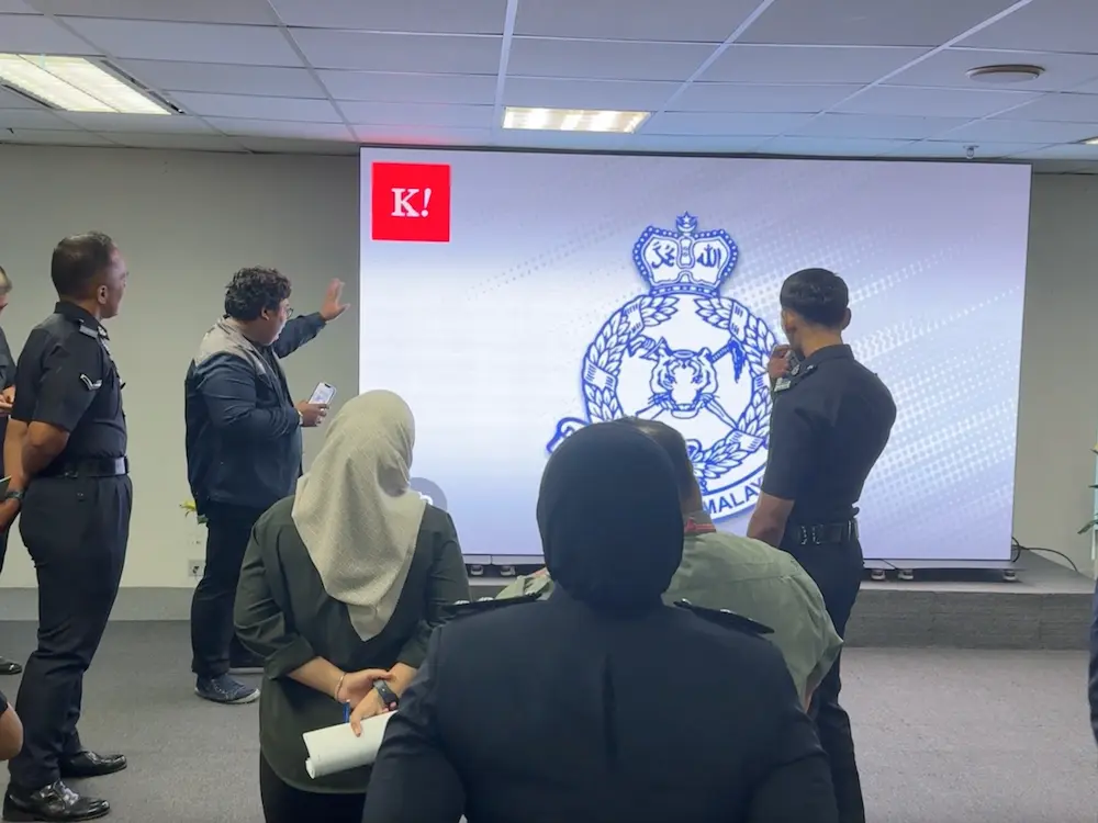Arvia LED poster display used during a briefing session in a Malaysian government hall