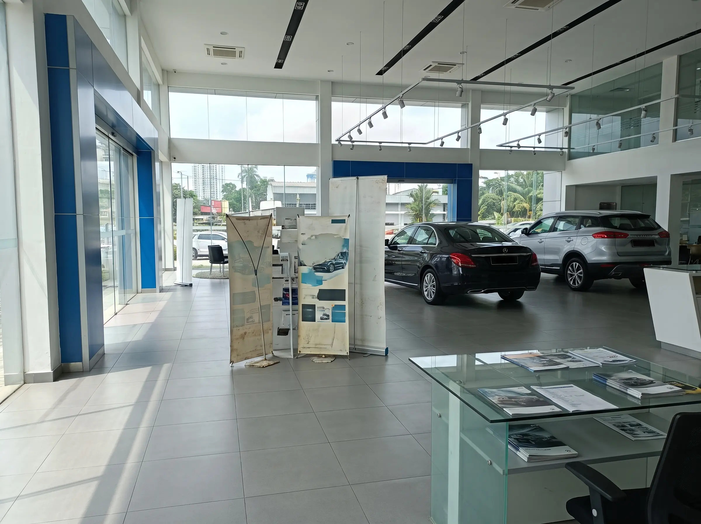 Static printed promotional materials inside an automotive showroom in Malaysia