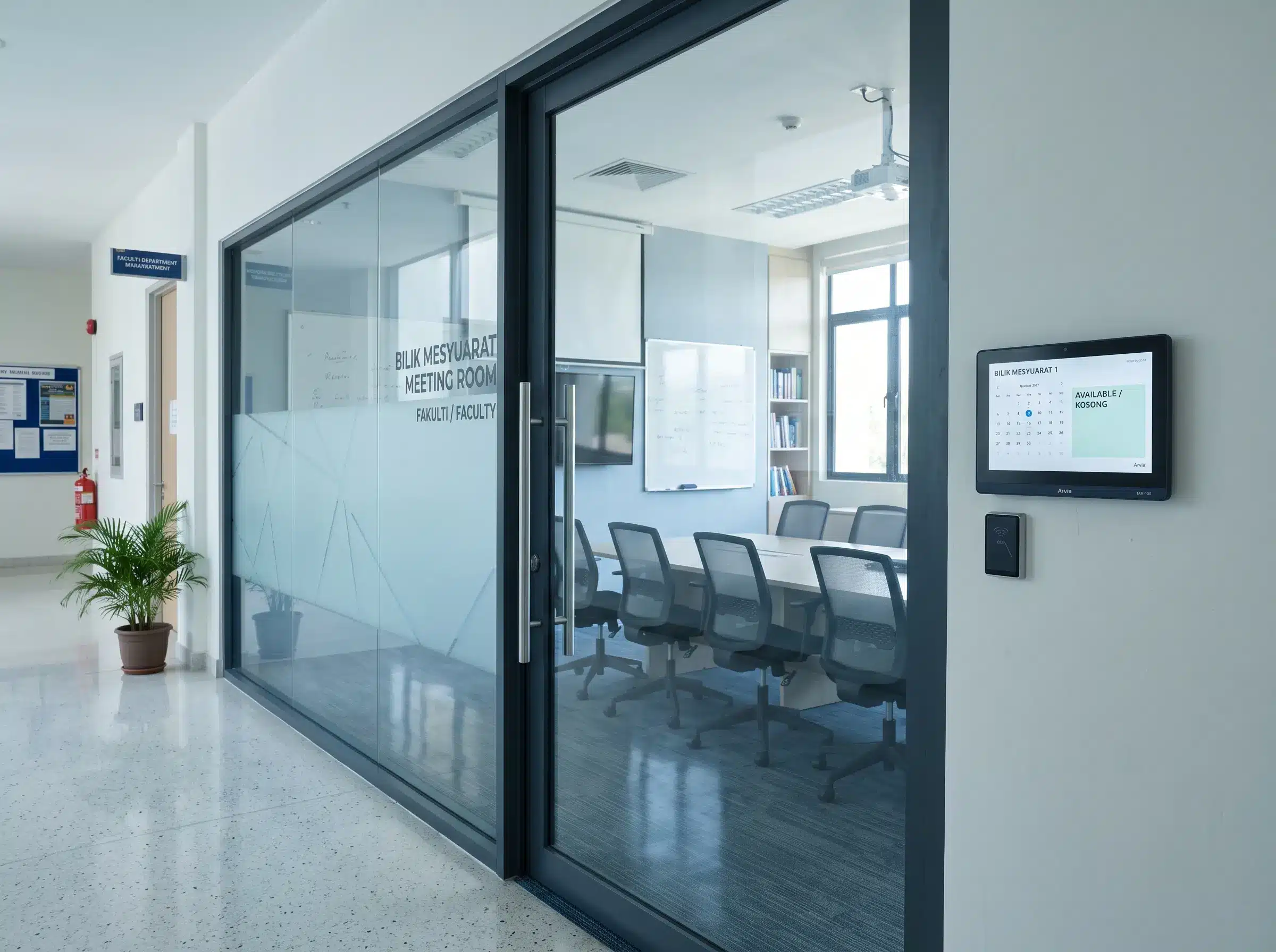 Arvia digital meeting room booking panel installed beside a university meeting room in Malaysia