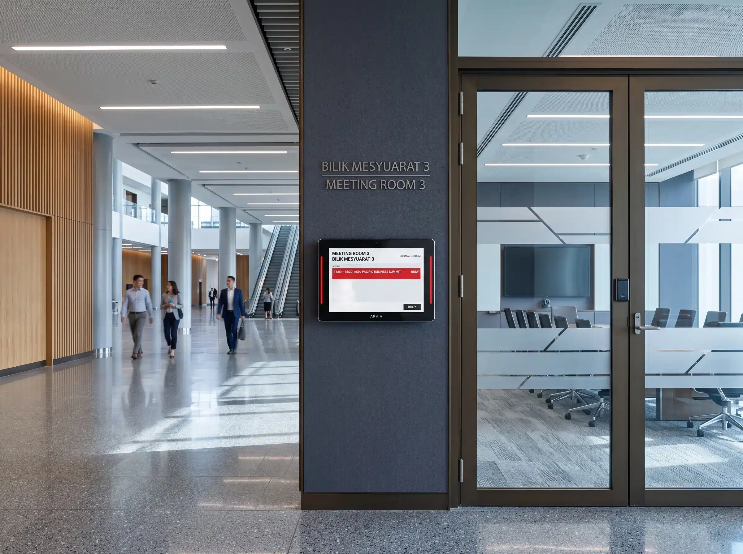 Arvia touchscreen meeting room booking system outside a modern conference and event venue in Malaysia